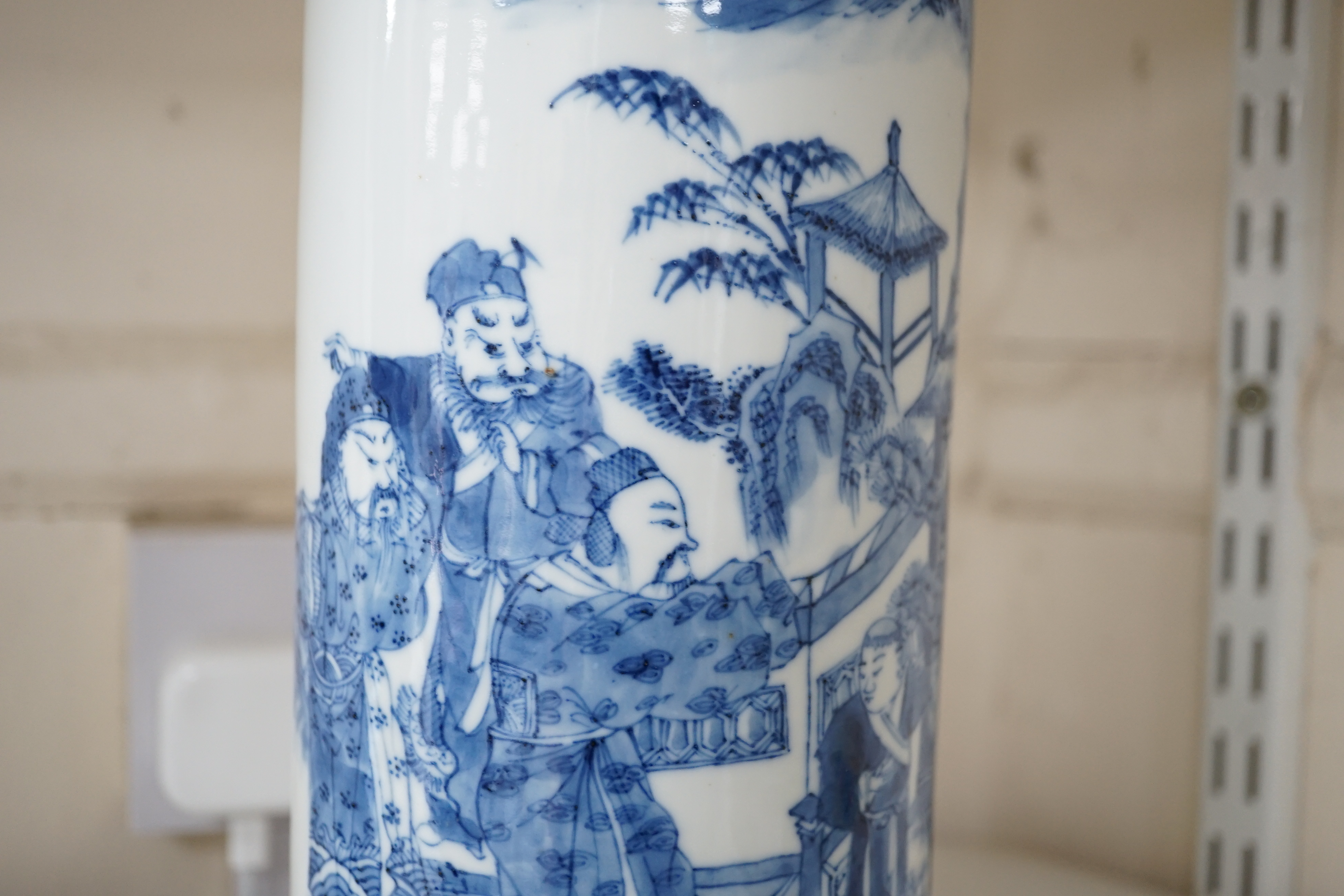 A Chinese blue and white ‘sages’ cylindrical brushpot, 19th century